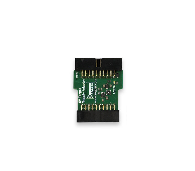 A small green circuit board with various electronic components. It has two black connectors at the top and a label reading "5V Target Supply Adapter." The board features multiple gold pins for connections and a small power indicator.