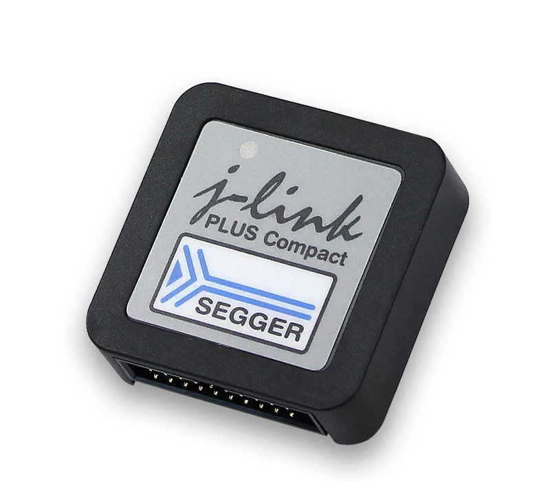 A compact black debugging tool labeled "j-link PLUS Compact" with the SEGGER logo. The tool features connectors on one side for interfacing with development boards, enabling programming and debugging of embedded systems.